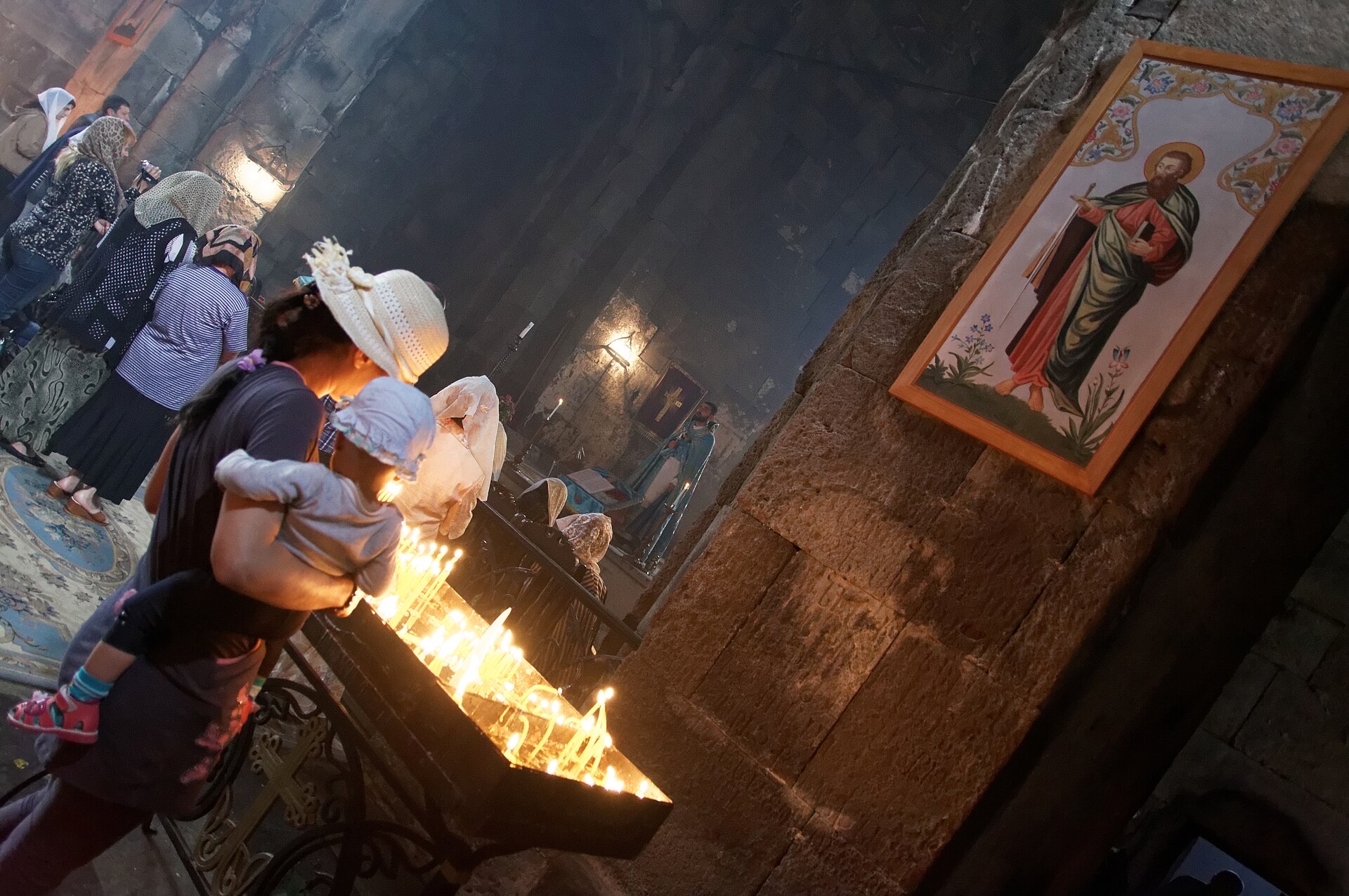 Candles burning on a stand in a church